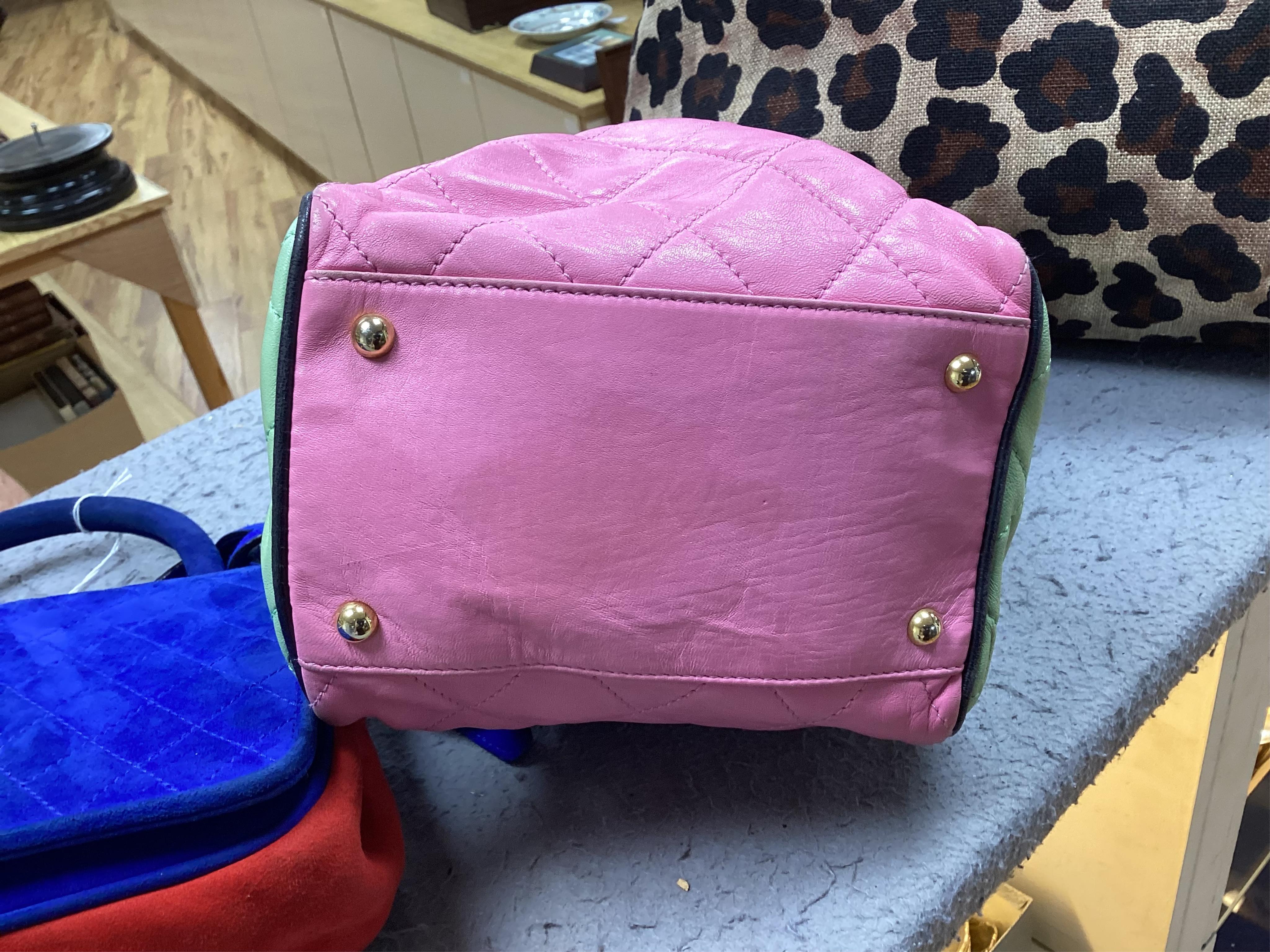 A selection of lady's handbags, including an animal print Stuart Weitzman shoulder bag with dust bag, an Escada suede royal blue and red shoulder bag, and another Escada handbag in navy blue with pink and light green qui